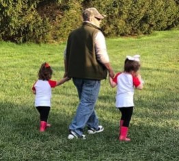 father grandfather david walking with girls at baseball